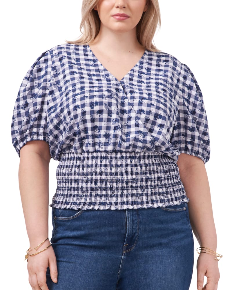 Front of a model wearing a size 0X Kirsten Smocked Top in GNGHM FLRL-119 by 1.State. | dia_product_style_image_id:262047